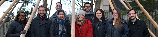 Students standing in Teepee structure