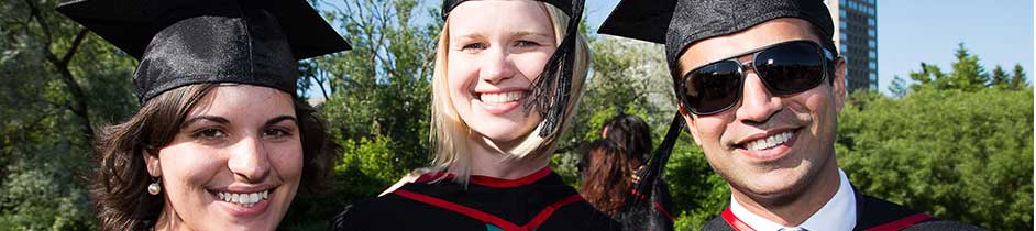 Three Graduating students in robe