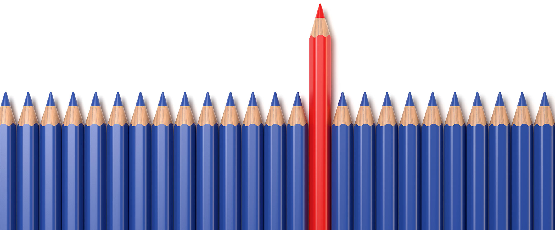 Row of blue penicls with one red pencil sticking up