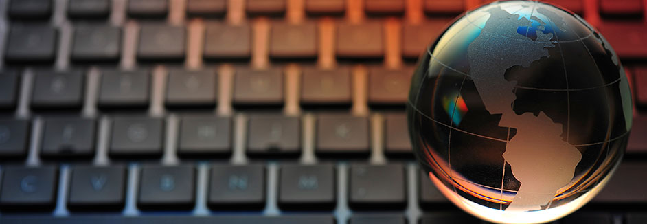 crystal globe sitting on keyboard