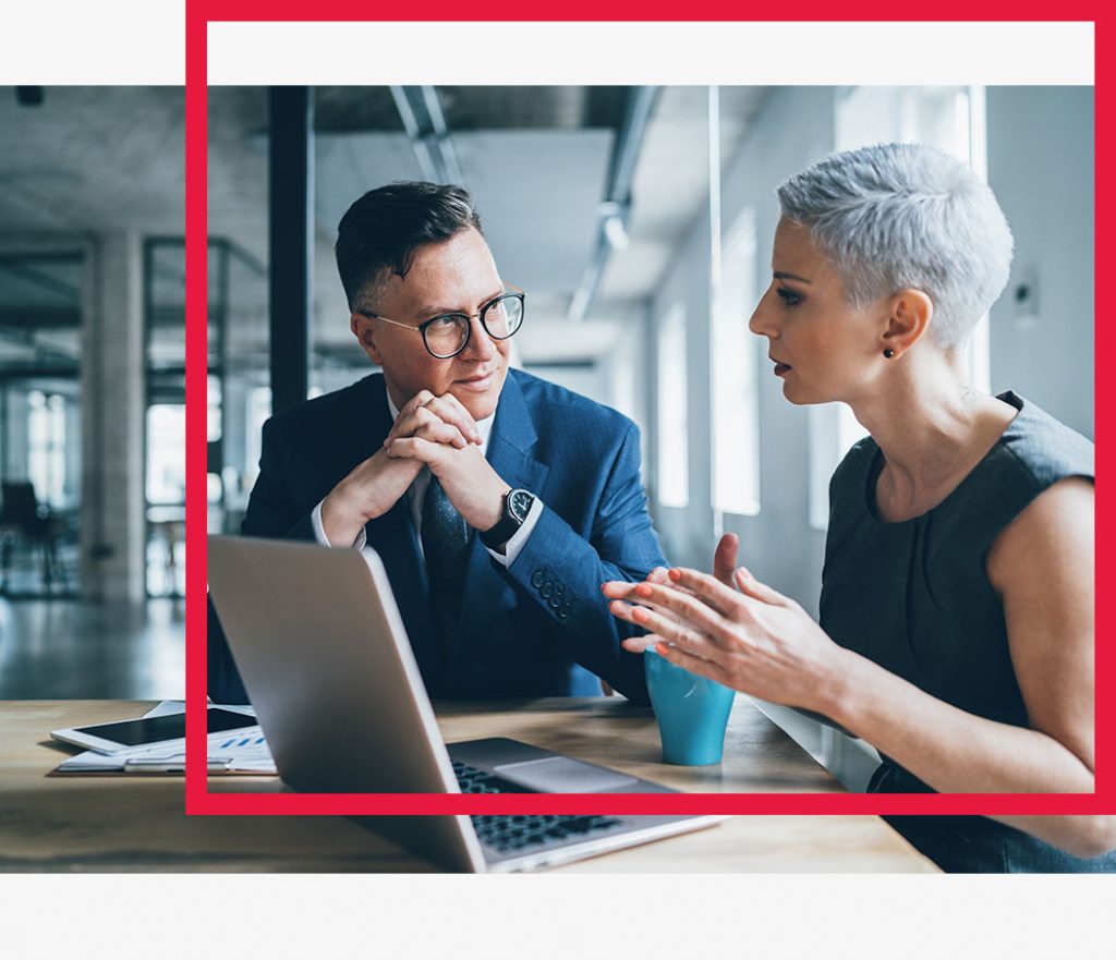 A man and woman in a meeting.