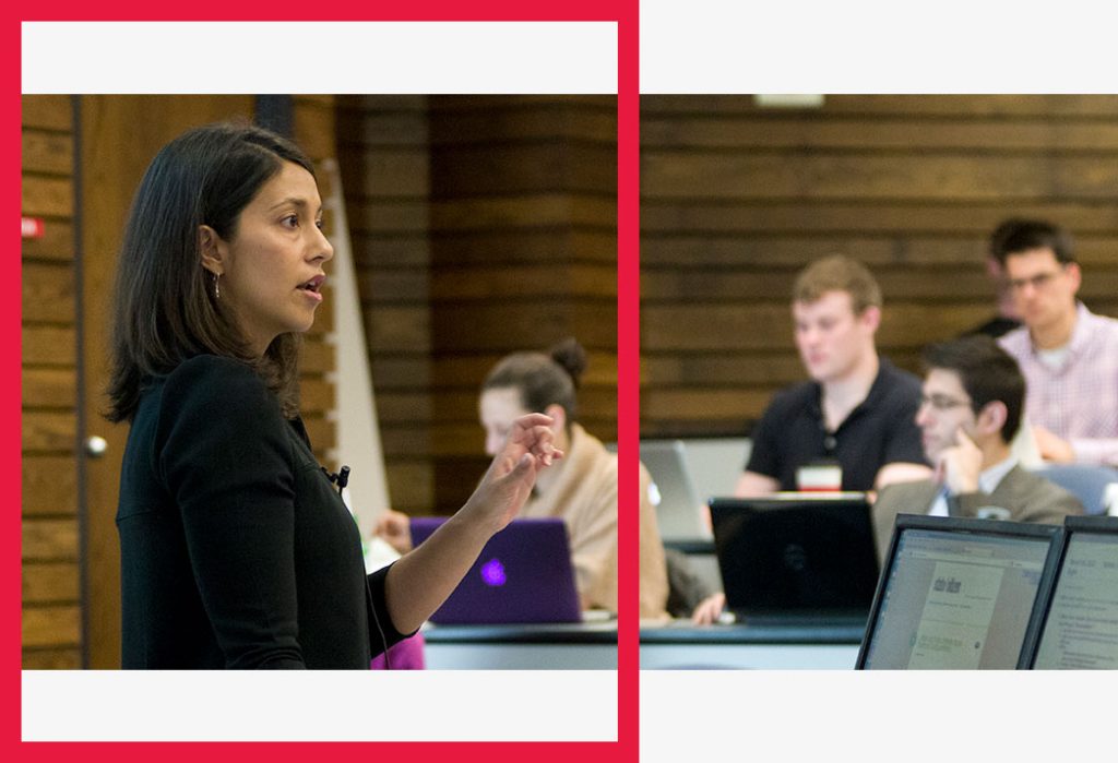 A professor speaks in front of a class.