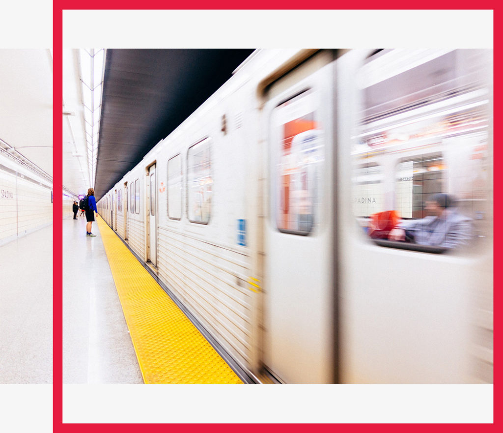 A subway train arrives at a station.