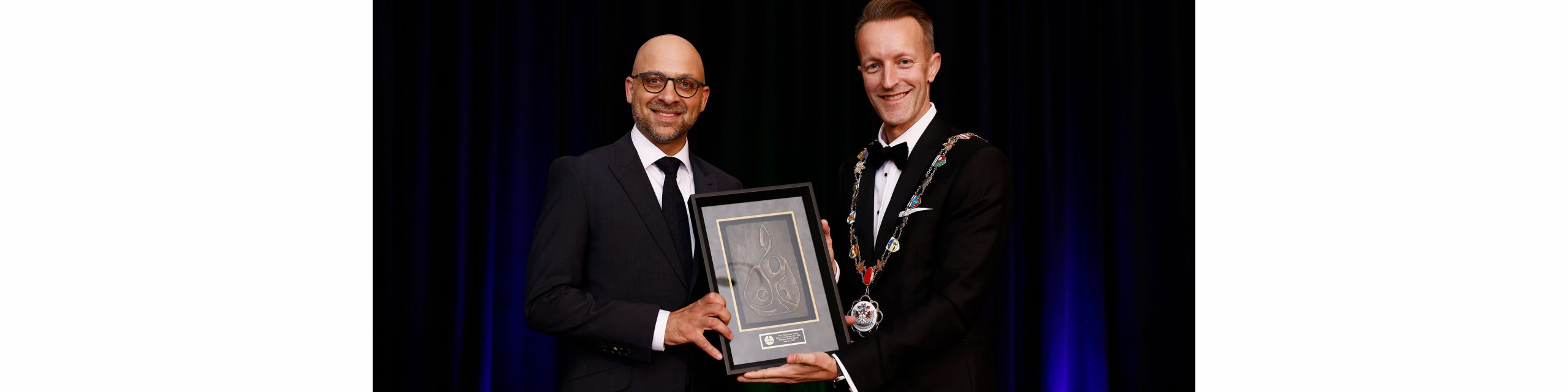 Faisal Bhabha accepting CBA award from Canadian Bar Association President Steeves Bujold