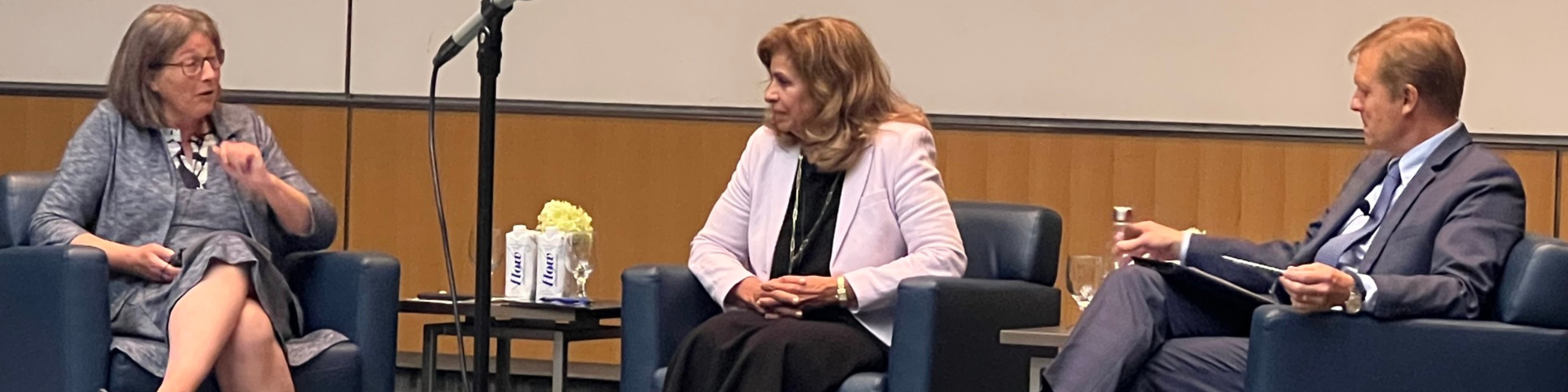 Photo of Andromache Karakatsanis (centre) on the Moot Court stage flanked by outgoing dean and Professor Mary Condon (left) and inconing dean and Professor Trevor Farrow.
