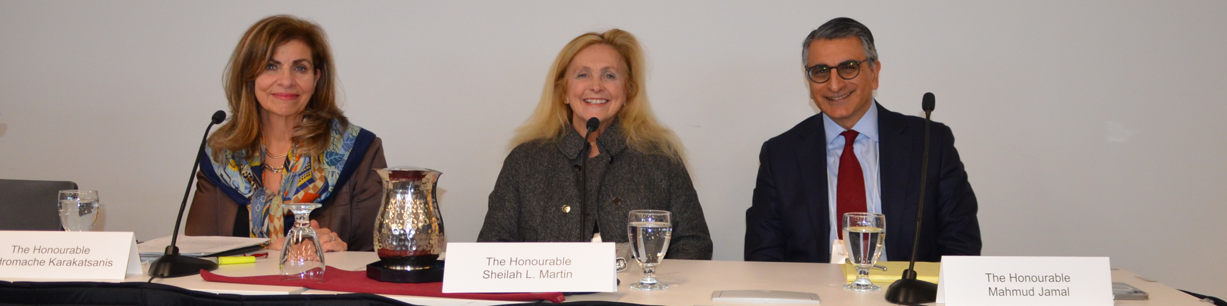 Photo of Supreme Court of Canada Justices Andromache Karakatsanis (left), Sheilah Martin and Mahmud Jamal sitting on a panel at an Osgoode conference Jan. 10, 2024, celebrating the legacy of former dean Peter W. Hogg.