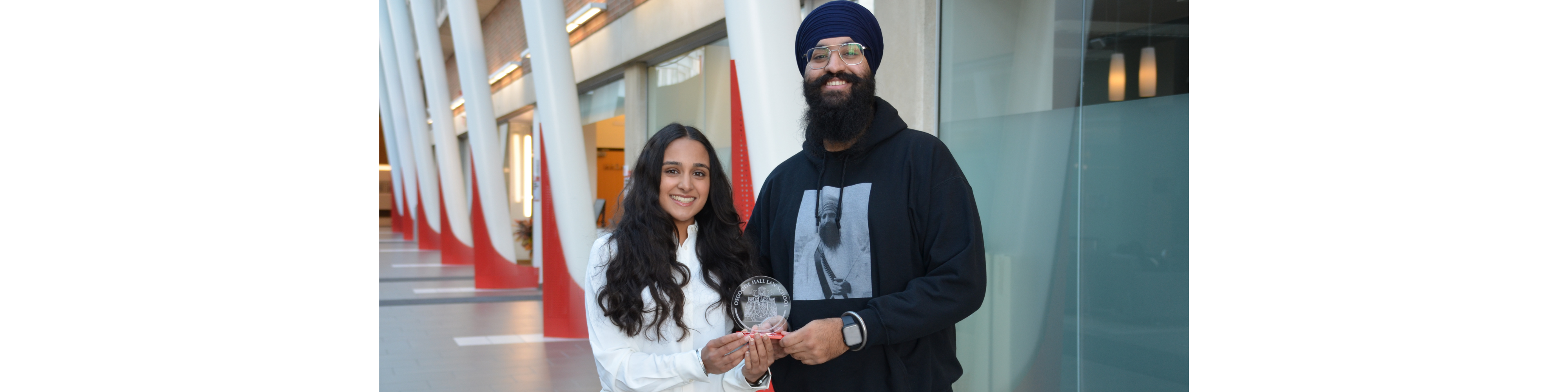 Photo of Osgoode Sikh Students' Association Co-Presidents Tripat Kaur Sandhu (left) and Dalraj Gill in Gowling's Hall