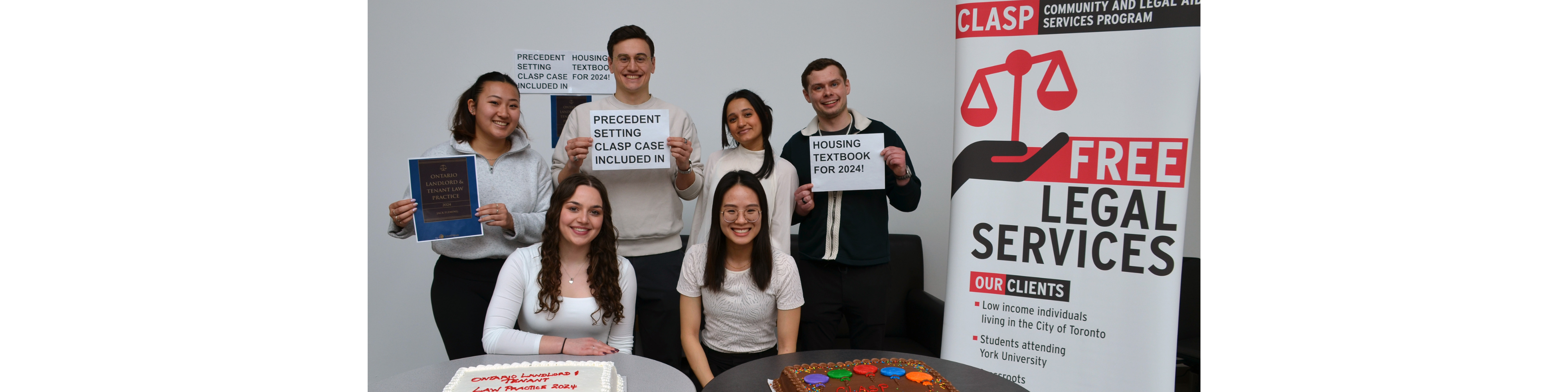 CLASP students in front of their banner