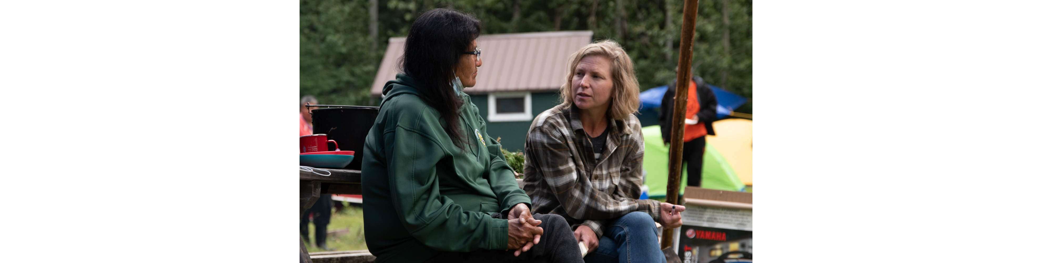 Photo of Professor Dayna Scott talking with an elder at Neskantaga First Nation in Northern Ontario.
