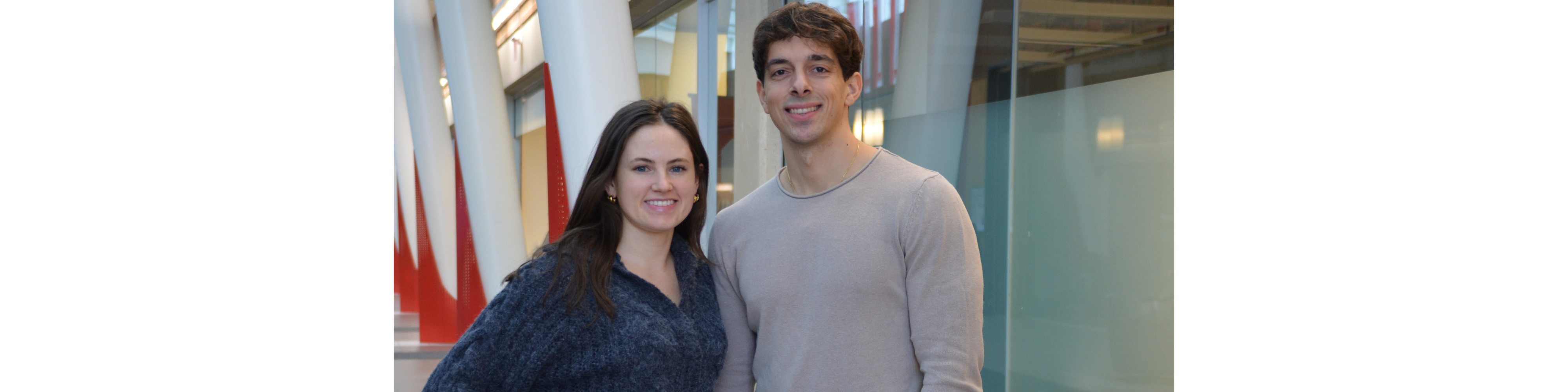 Photo of Osgoode Venture Capital Law Society executive members and clothing drive co-organizers Emma Kirwin (left) and Yianni Patiniotis.